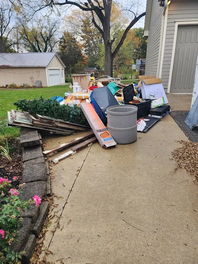Dumpster being loaded with debris for Residential Dumpster Rental in Pevely